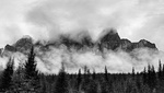 Castle Mountain shrouded by clouds and fog